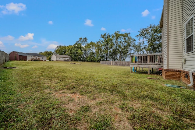 view of yard featuring a wooden deck