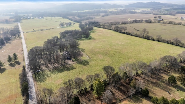 drone / aerial view featuring a mountain view and a rural view