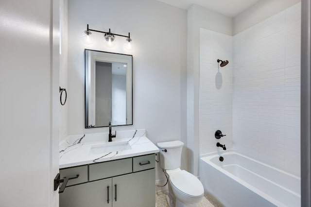 full bathroom featuring toilet, vanity, and tub / shower combination