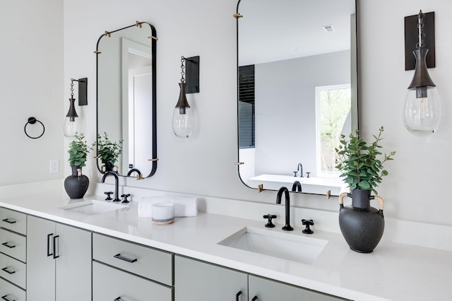 bathroom with vanity and a bathing tub