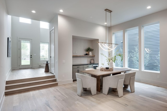 dining space with light hardwood / wood-style floors