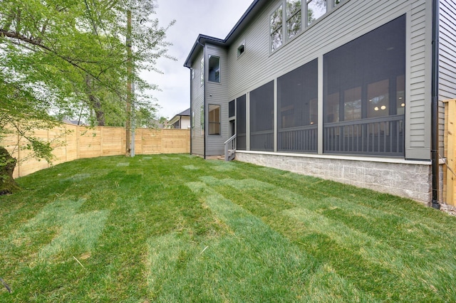 view of yard featuring a sunroom