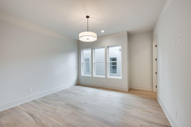 unfurnished room featuring light hardwood / wood-style flooring