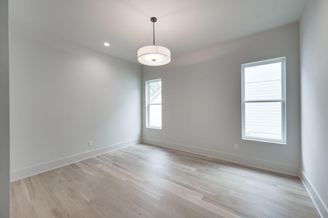 spare room with light hardwood / wood-style floors