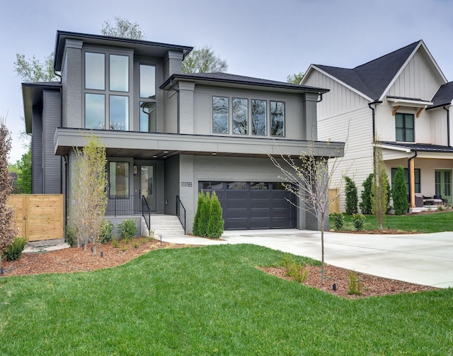 view of front of home featuring a porch, a garage, and a front lawn