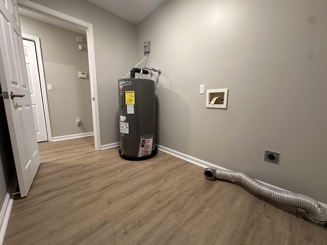 utility room featuring water heater