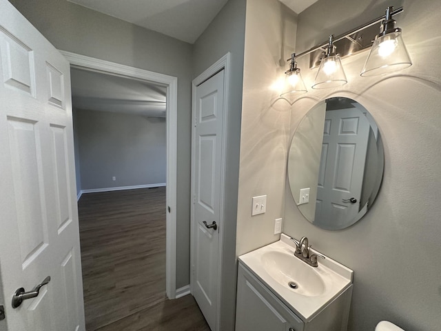 bathroom with hardwood / wood-style floors and vanity