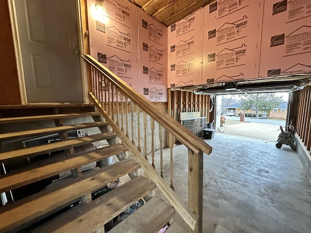 stairs featuring concrete floors