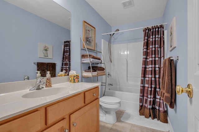 full bathroom featuring toilet, shower / bath combo, vanity, and tile patterned floors