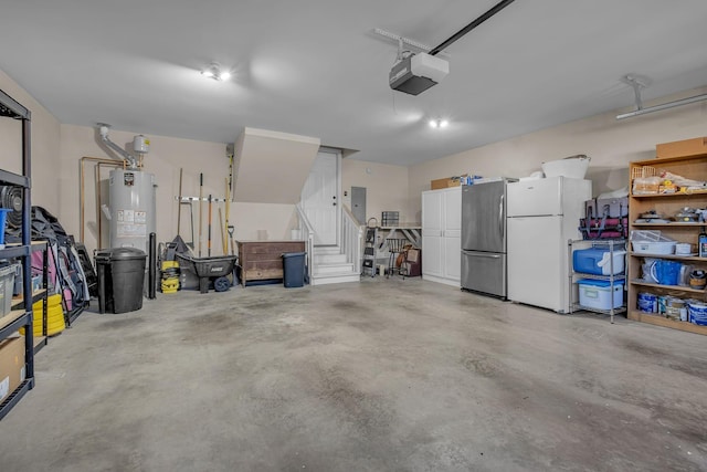 garage featuring electric panel, white fridge, gas water heater, and a garage door opener