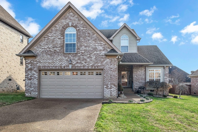 view of front property featuring a front lawn and a garage