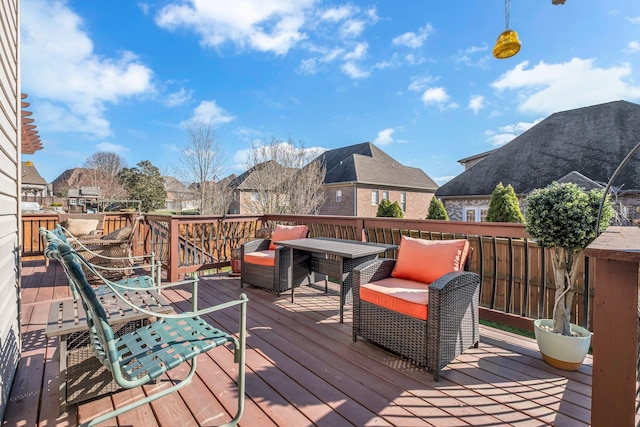 deck featuring outdoor lounge area