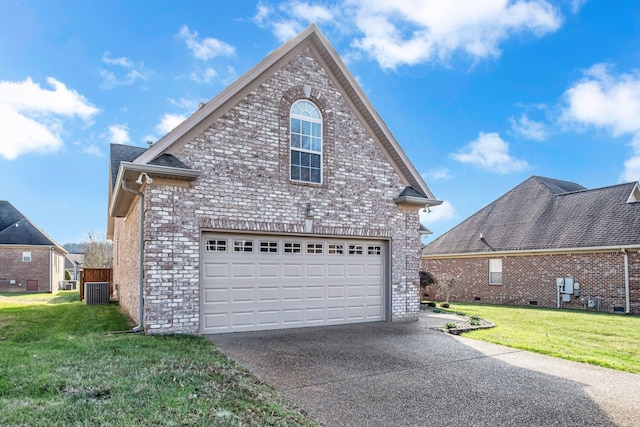 view of side of property featuring a yard and a garage