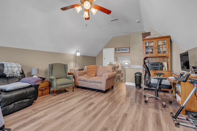 office space with ceiling fan, light wood-type flooring, and vaulted ceiling