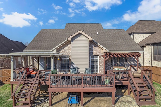 back of house with a pergola and a wooden deck