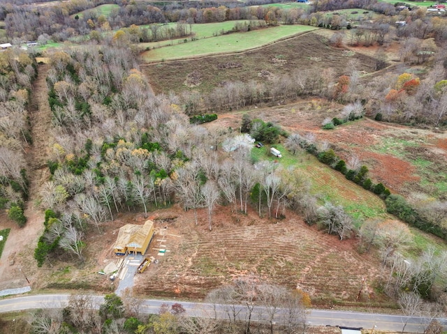 birds eye view of property featuring a rural view