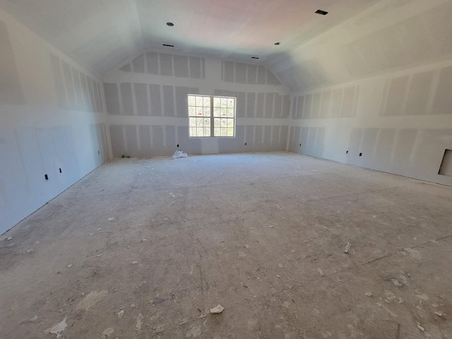 additional living space featuring vaulted ceiling