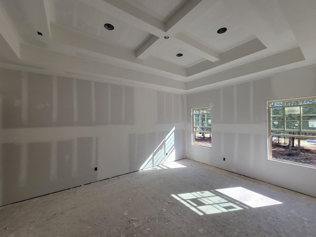 unfurnished room with beamed ceiling and coffered ceiling