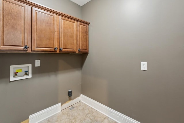 washroom featuring hookup for an electric dryer, cabinets, and washer hookup