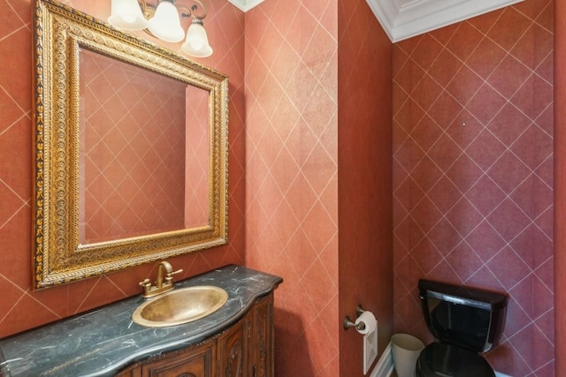 bathroom featuring vanity, toilet, and crown molding