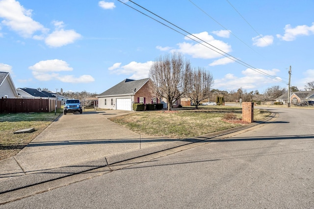 view of front of home with a garage and a front yard