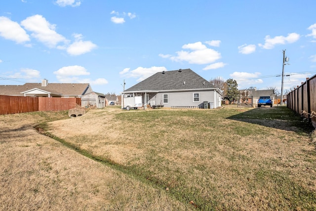 back of property featuring a lawn