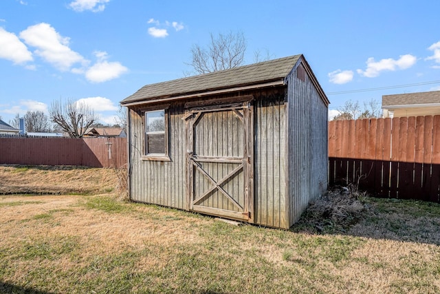 view of outbuilding with a lawn