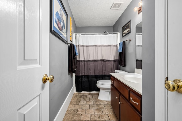 bathroom with vanity, a shower with shower curtain, a textured ceiling, and toilet