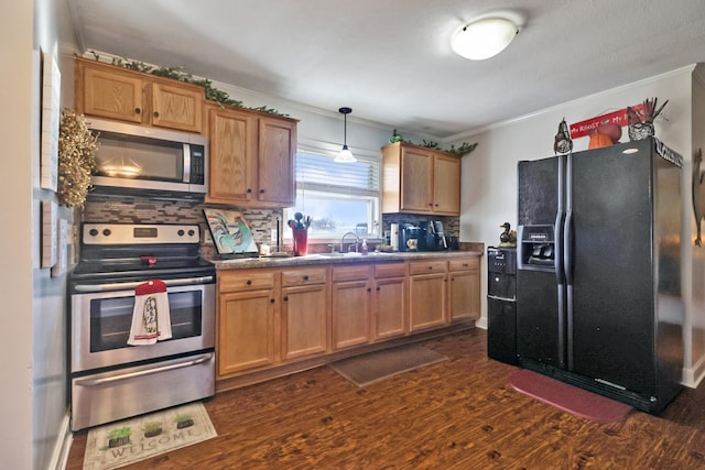 kitchen with sink, stainless steel appliances, dark hardwood / wood-style floors, backsplash, and pendant lighting