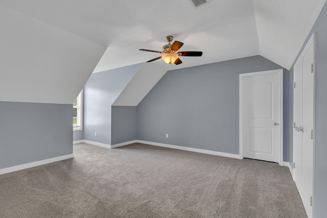 additional living space featuring carpet, ceiling fan, and lofted ceiling