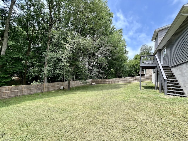 view of yard with a wooden deck