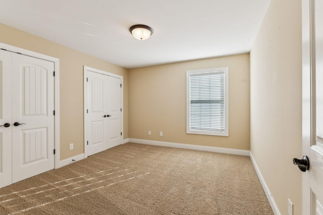 unfurnished bedroom with carpet floors