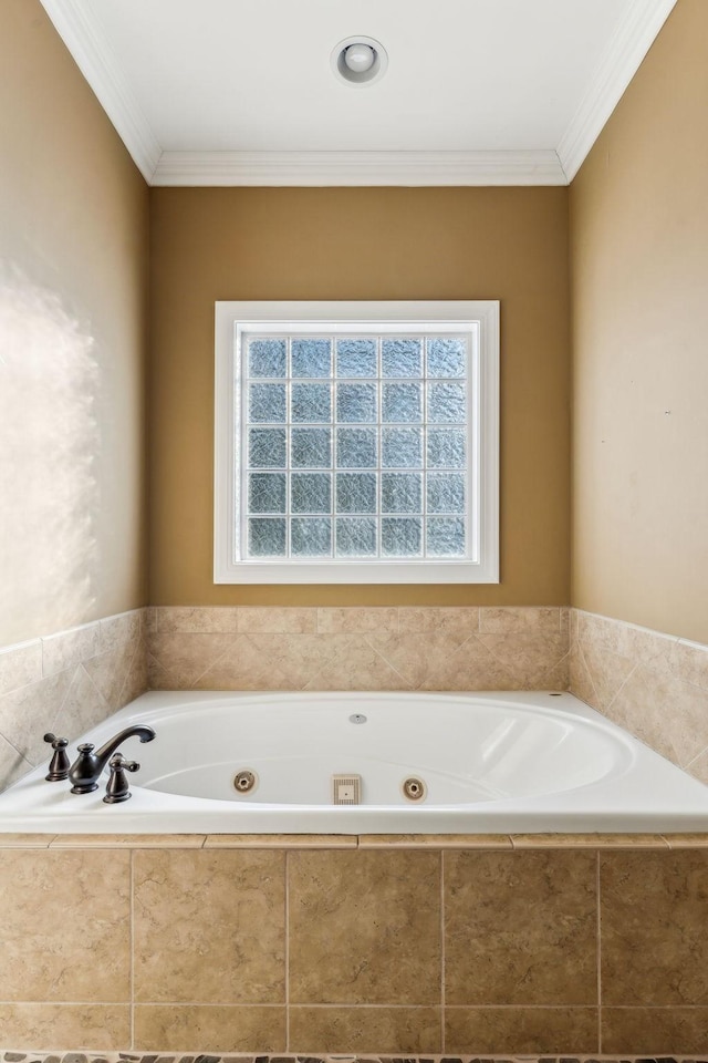 bathroom with a relaxing tiled tub and crown molding