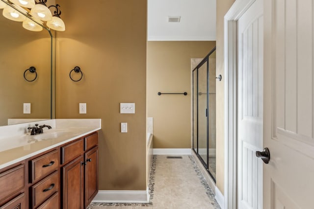 bathroom featuring vanity, tile patterned flooring, crown molding, and shower with separate bathtub