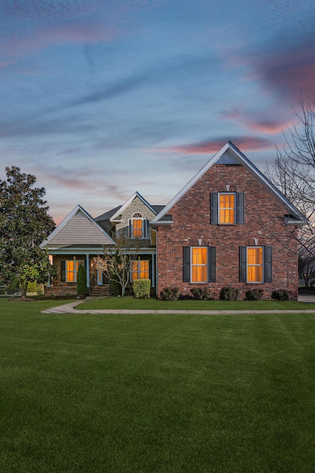 view of front of property with a yard