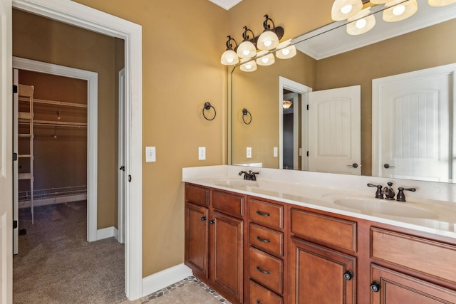 bathroom with tile patterned flooring, vanity, and ornamental molding