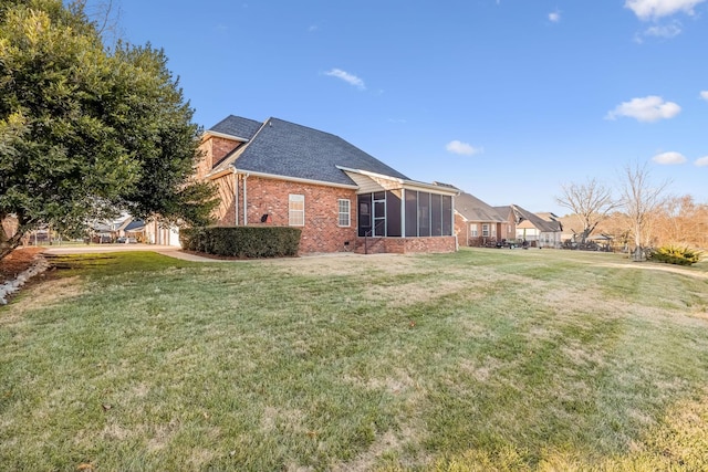 view of yard with a sunroom