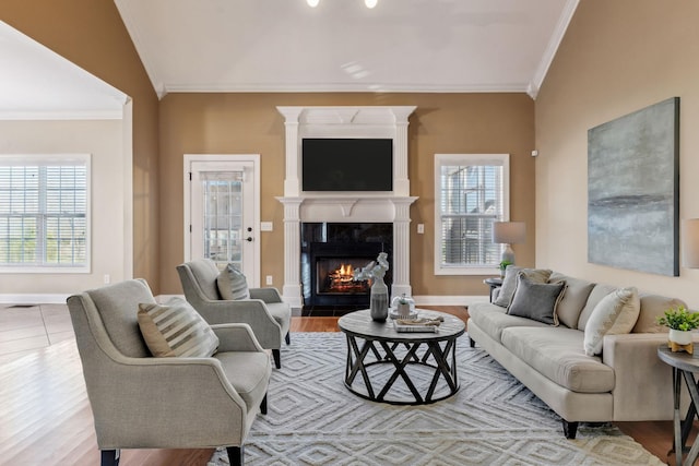 living room featuring ornamental molding and light wood-type flooring