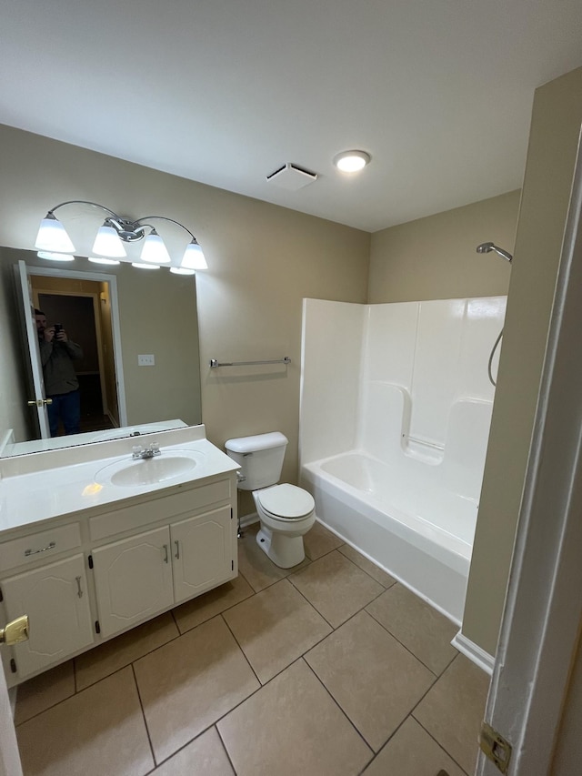 full bathroom featuring tile patterned flooring, vanity, bathing tub / shower combination, and toilet