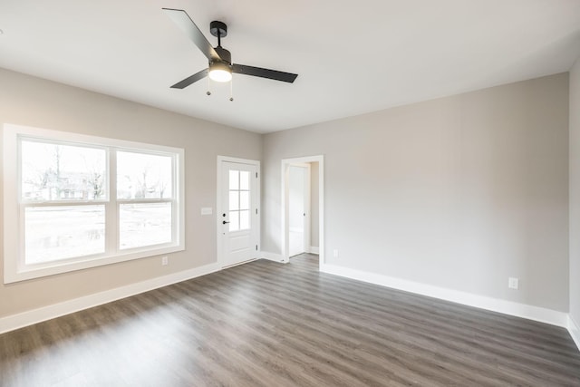 spare room featuring ceiling fan and dark hardwood / wood-style flooring