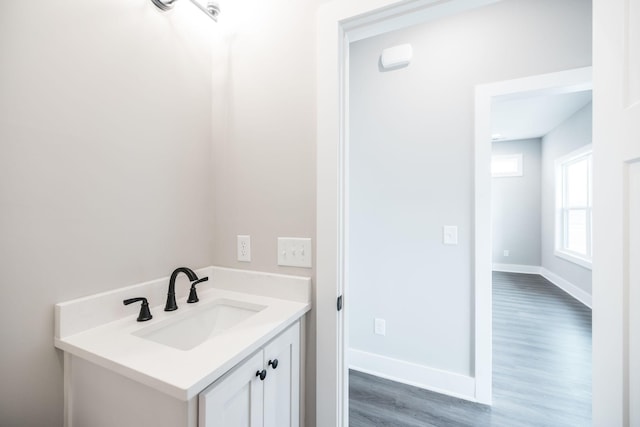 bathroom featuring hardwood / wood-style floors and vanity