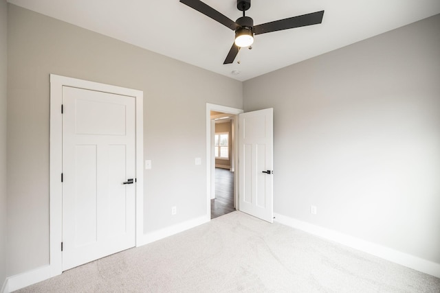 unfurnished bedroom with carpet and ceiling fan