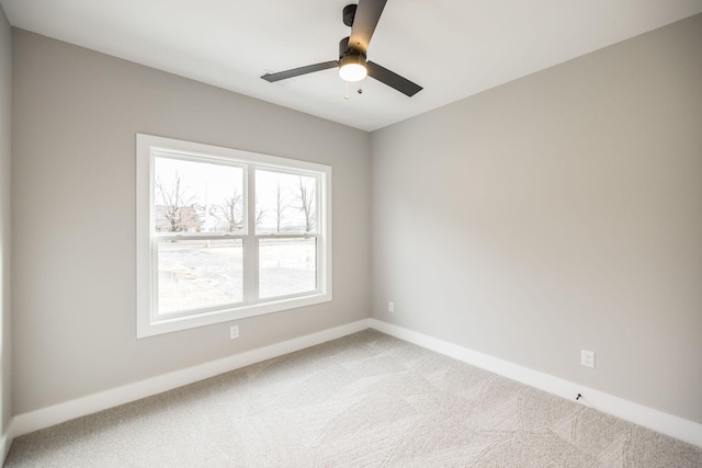 carpeted empty room with ceiling fan