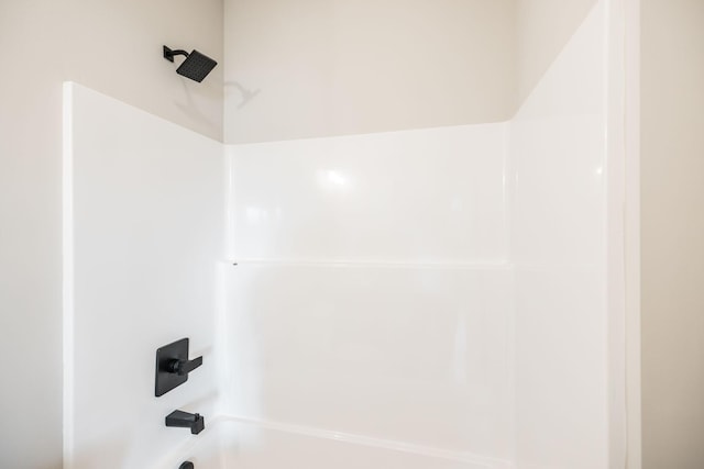 interior details featuring shower / bathing tub combination