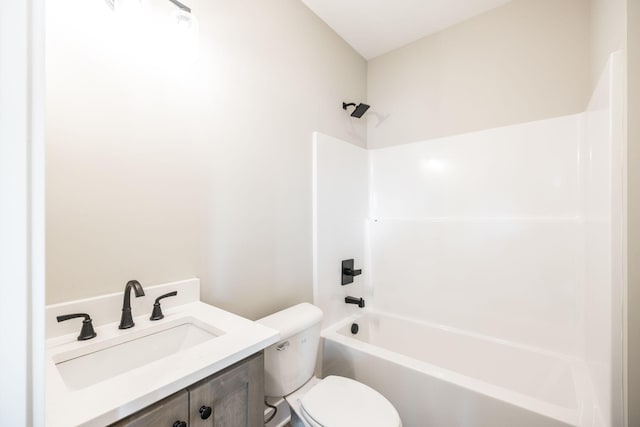 full bathroom featuring bathing tub / shower combination, vanity, and toilet