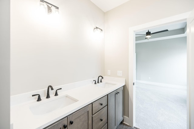 bathroom featuring ceiling fan and vanity