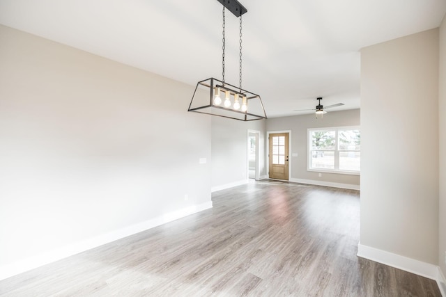 interior space with ceiling fan and light hardwood / wood-style flooring