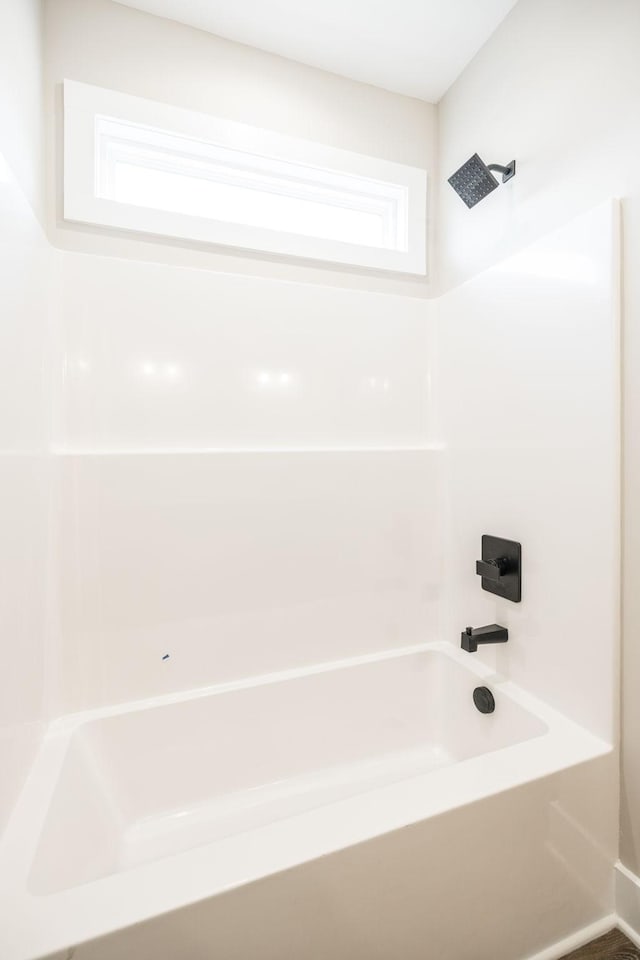 bathroom featuring  shower combination