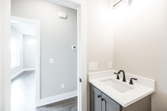 bathroom with vanity and hardwood / wood-style flooring