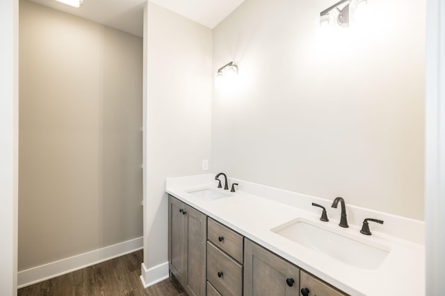 bathroom with hardwood / wood-style floors and vanity